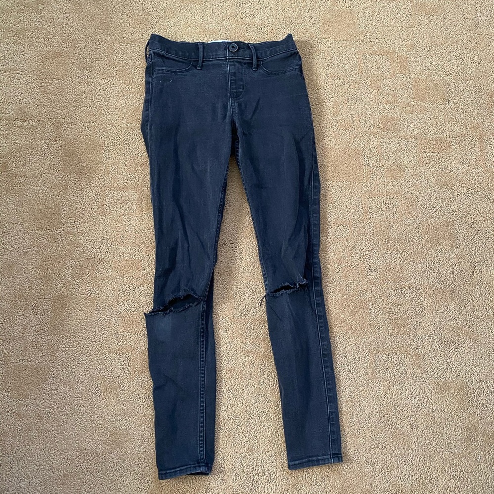 low rise black ripped jeans